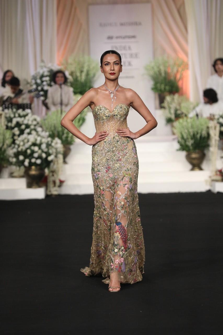 The embroidery artworks include pride of peacocks frolicking in a Mughal Garden, fiery red pomegranate flowers turning to ripe fruit, a bouquet of peonies, and a busy fish pond full of lilies in the golden sun. 
