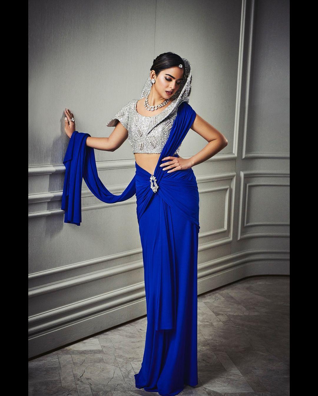 For the sangeet ceremony, the billionaire heiress chose a blue saree from an Italian haute couture house. She paired it with a silver blouse and polki jewellery.