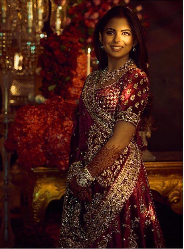 Reception looks
For her 1st reception, Isha Ambani Piramal chose a custom velvet lehenga from Sabyasachi's zardosi revival series. 