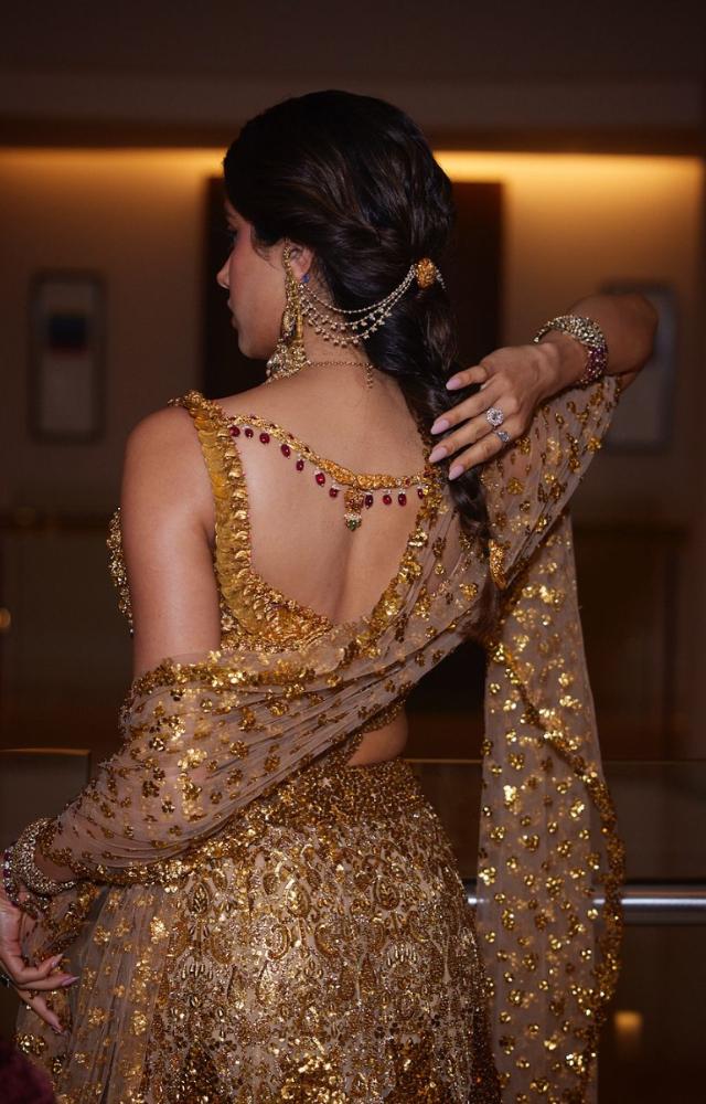 She completed the look with glossy makeup and heavy Indian jewellery