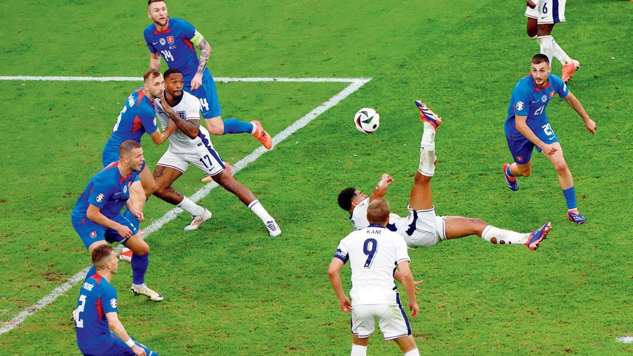 England’s Jude Bellingham scores from an overhead kick against Slovakia in Gelsenkirchen, Germany, on Sunday