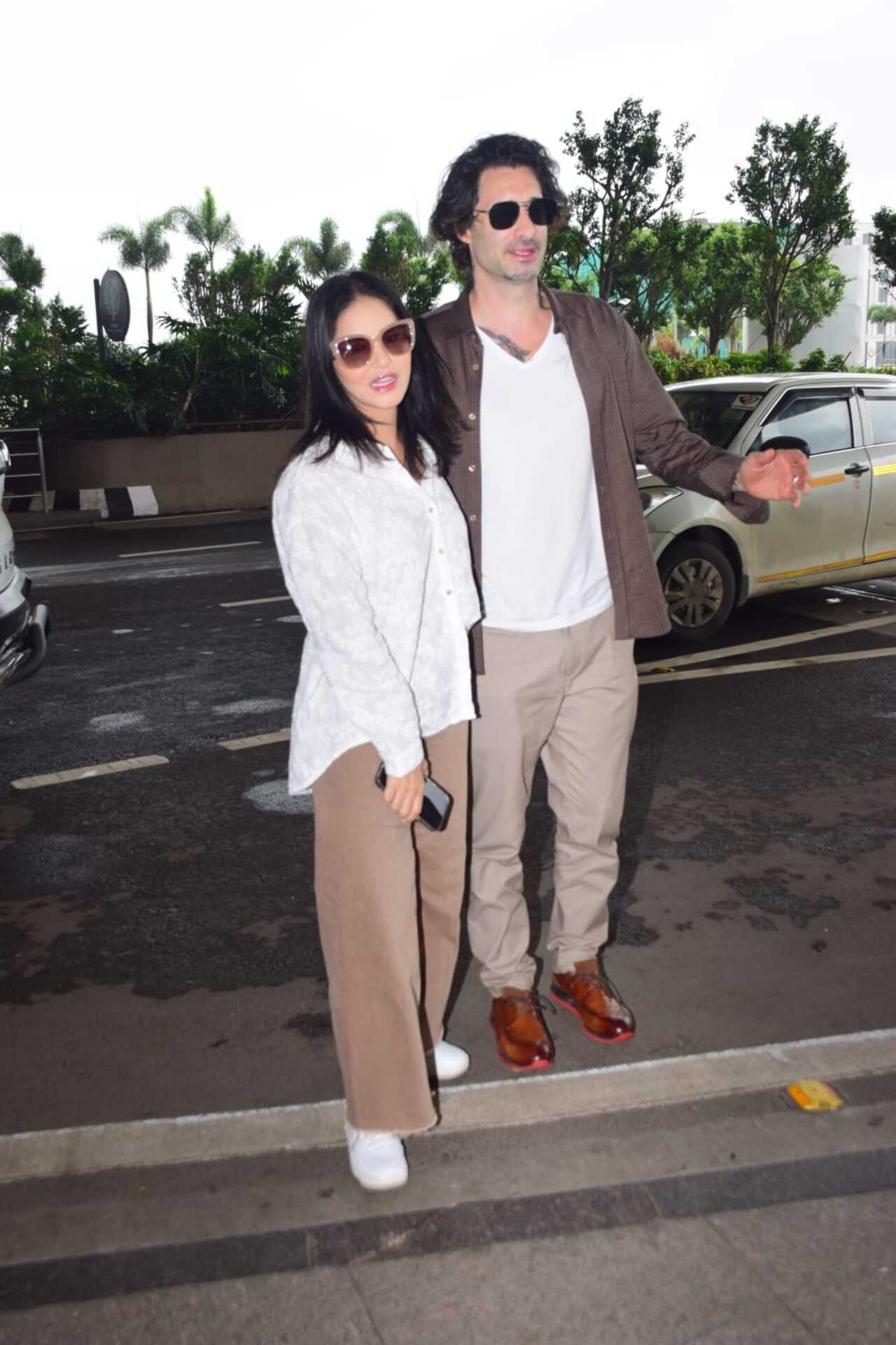 Sunny Leone and her husband Daniel Weber strike a pose at the Mumbai airport