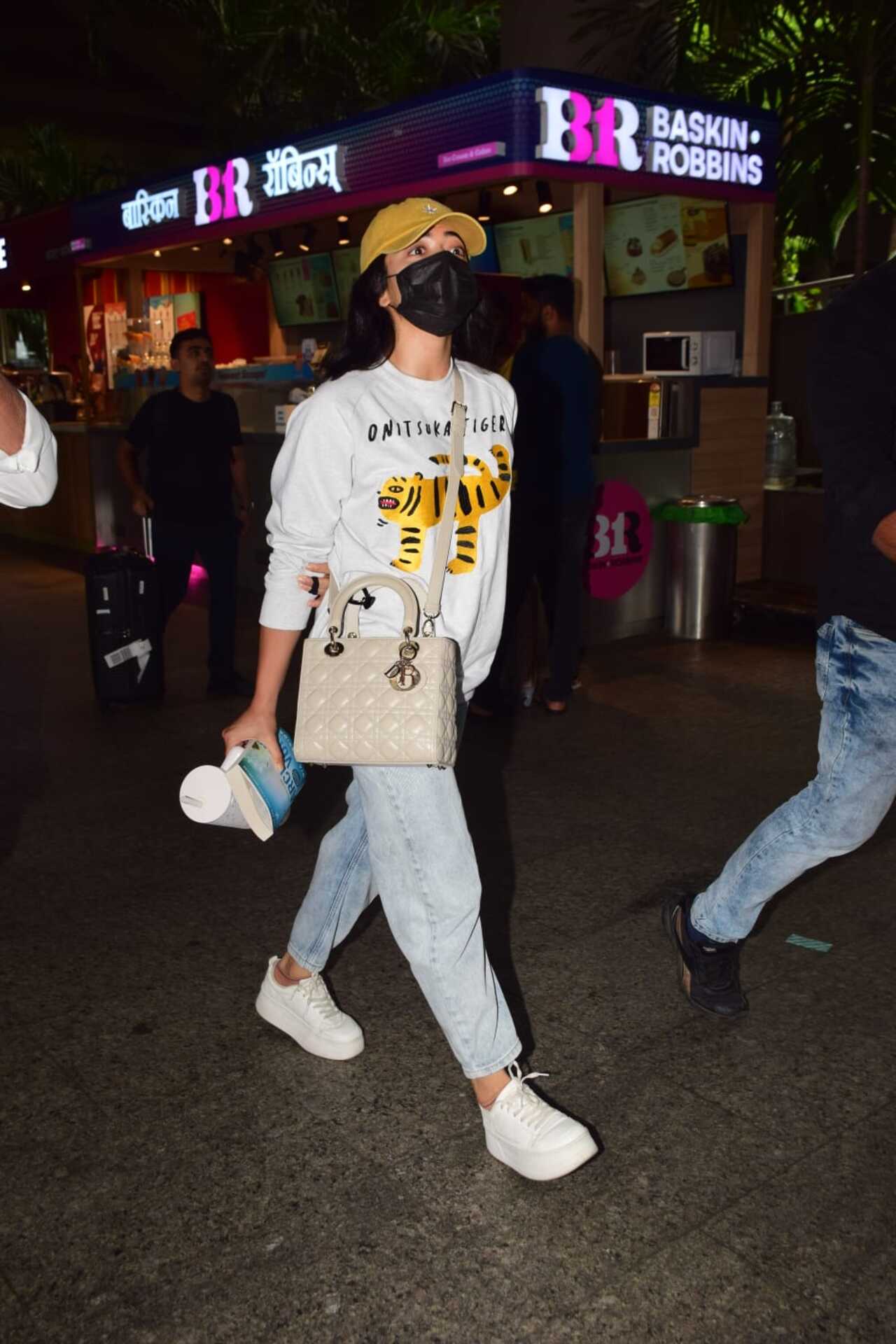 Rashmika Mandanna spotted at Mumbai airport in a casual look and her face covered with a mask