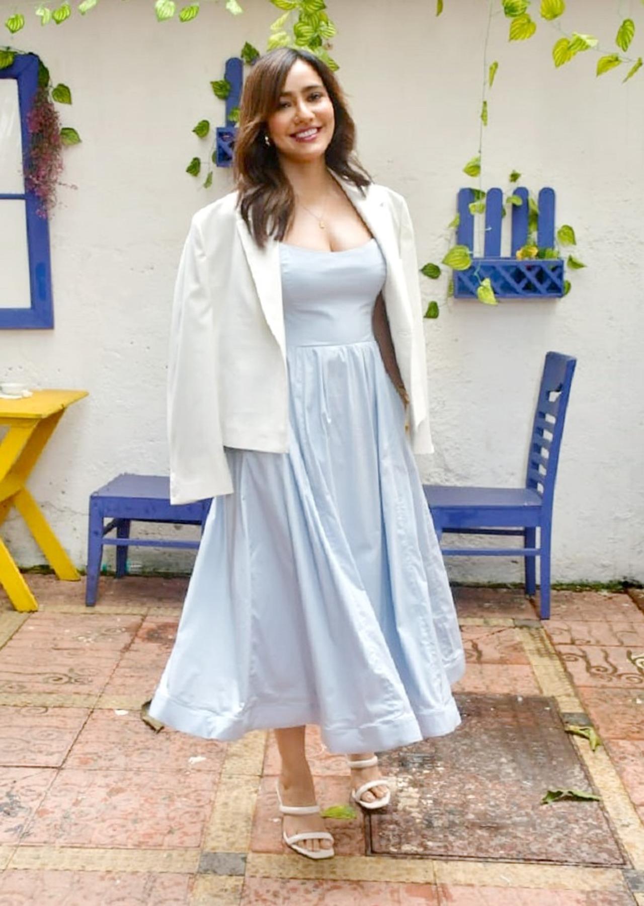 Neha Sharma pairs a flowy blue dress with a jacket for the promotions of Sony LIV's '36 Days'