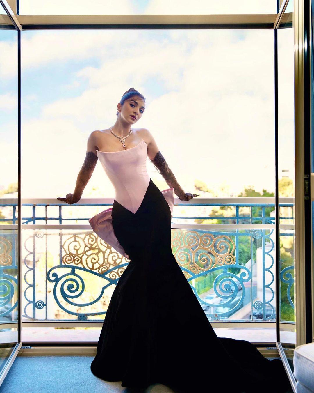 For a Cannes event, Kiara Advani wore a pink and black corset gown with a striking oversized bow at the back, chosen from the shelves of Prabal Gurung.