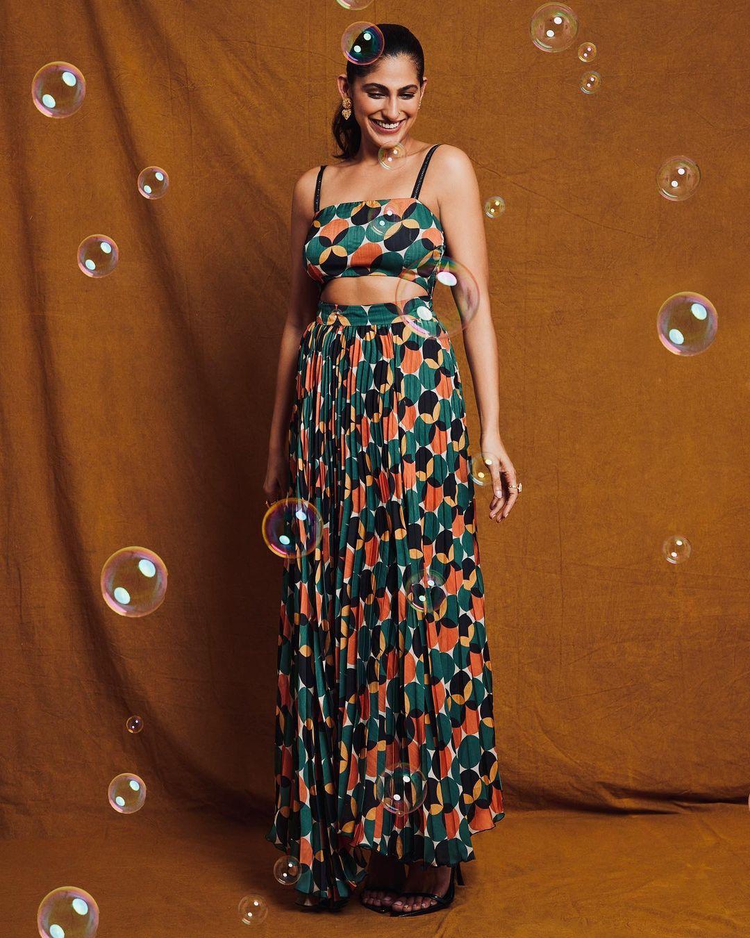 Kubbra wore a multi-colored printed midi dress from VERB by Pallavi Singhee.