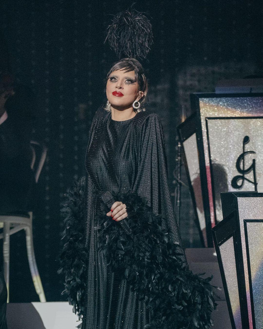 It was adorned with a plethora of feathers at the sleeves.