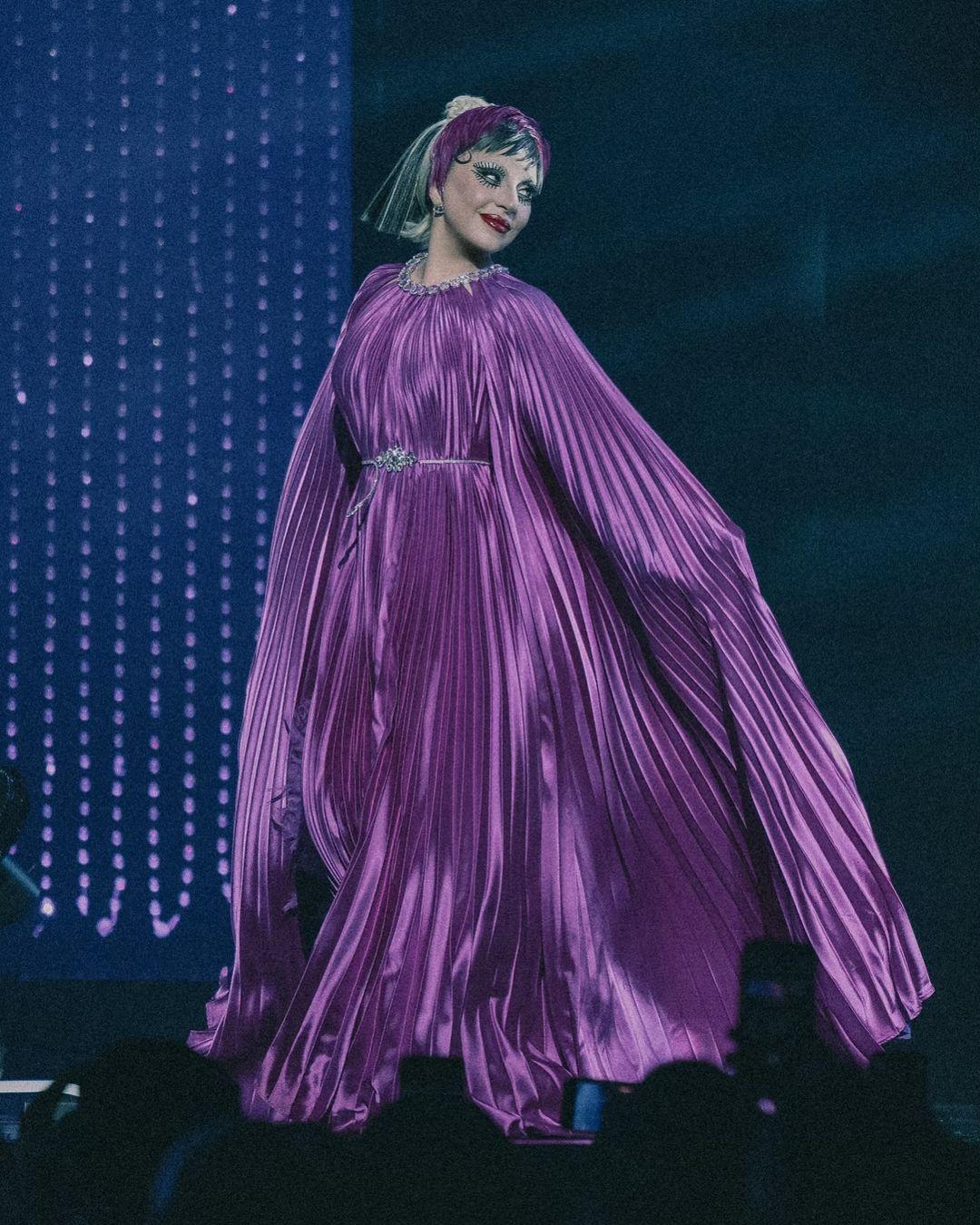 The gown also featured a pleated cape that added to its dramatic flair.