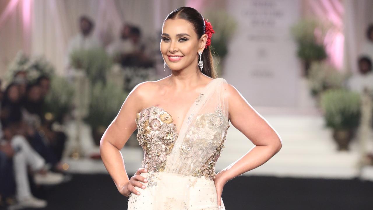 Lisa Ray stuns in a saree-gown with peacock-themed train by Rahul Mishra 