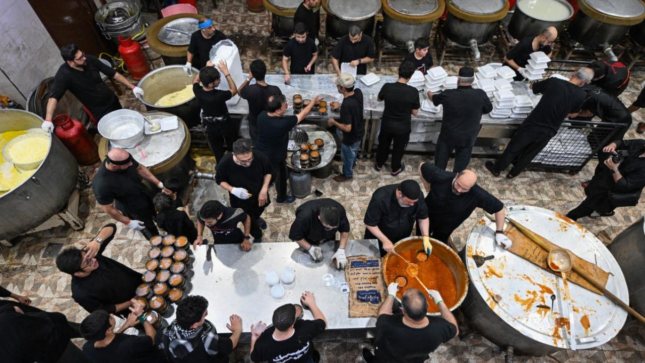 In Photo: Volunteers prepare meals for Shiite Muslims taking part in a traditional mourning ritual during Ashura in Kuwait City on July 16, 2024