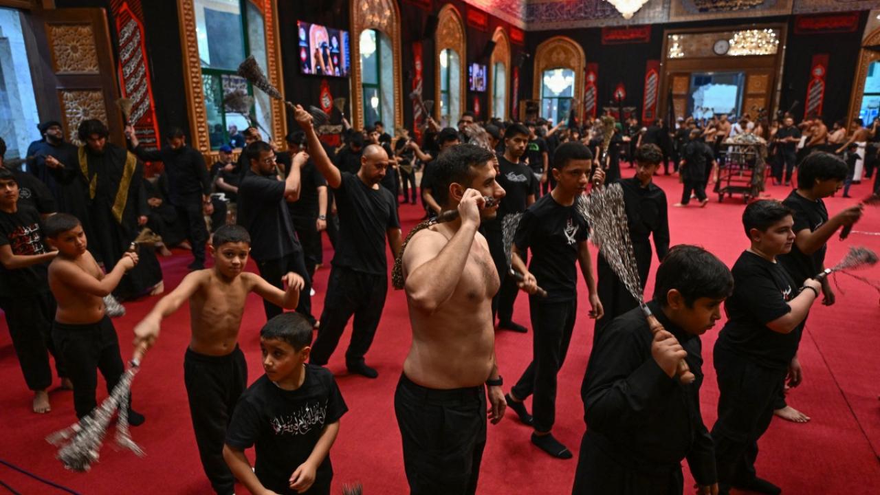 In Photo: Shiite Muslims take part in a traditional mourning ritual during Ashura in Kuwait City