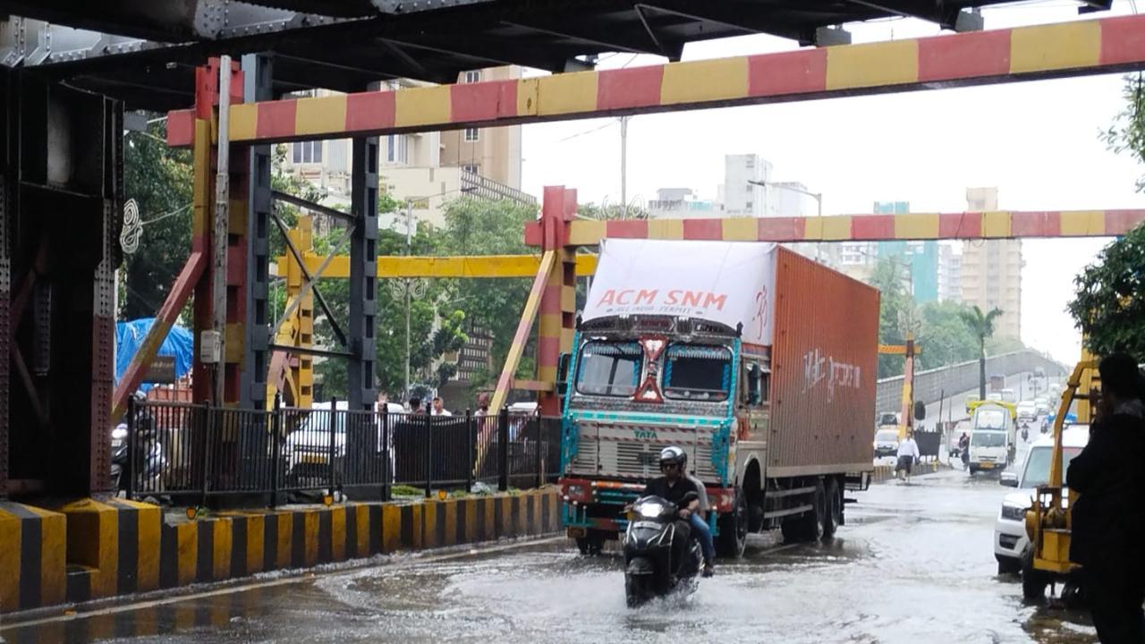 Heavy rain brings Mumbai to halt, road & rail traffic hit, schools shut
