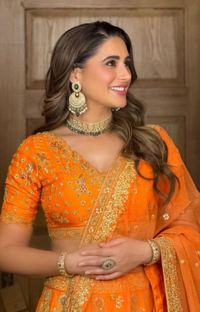 Nargis Fakhri in a  bright yellow colored lehenga is a perfect look for a mehendi ceremony. 