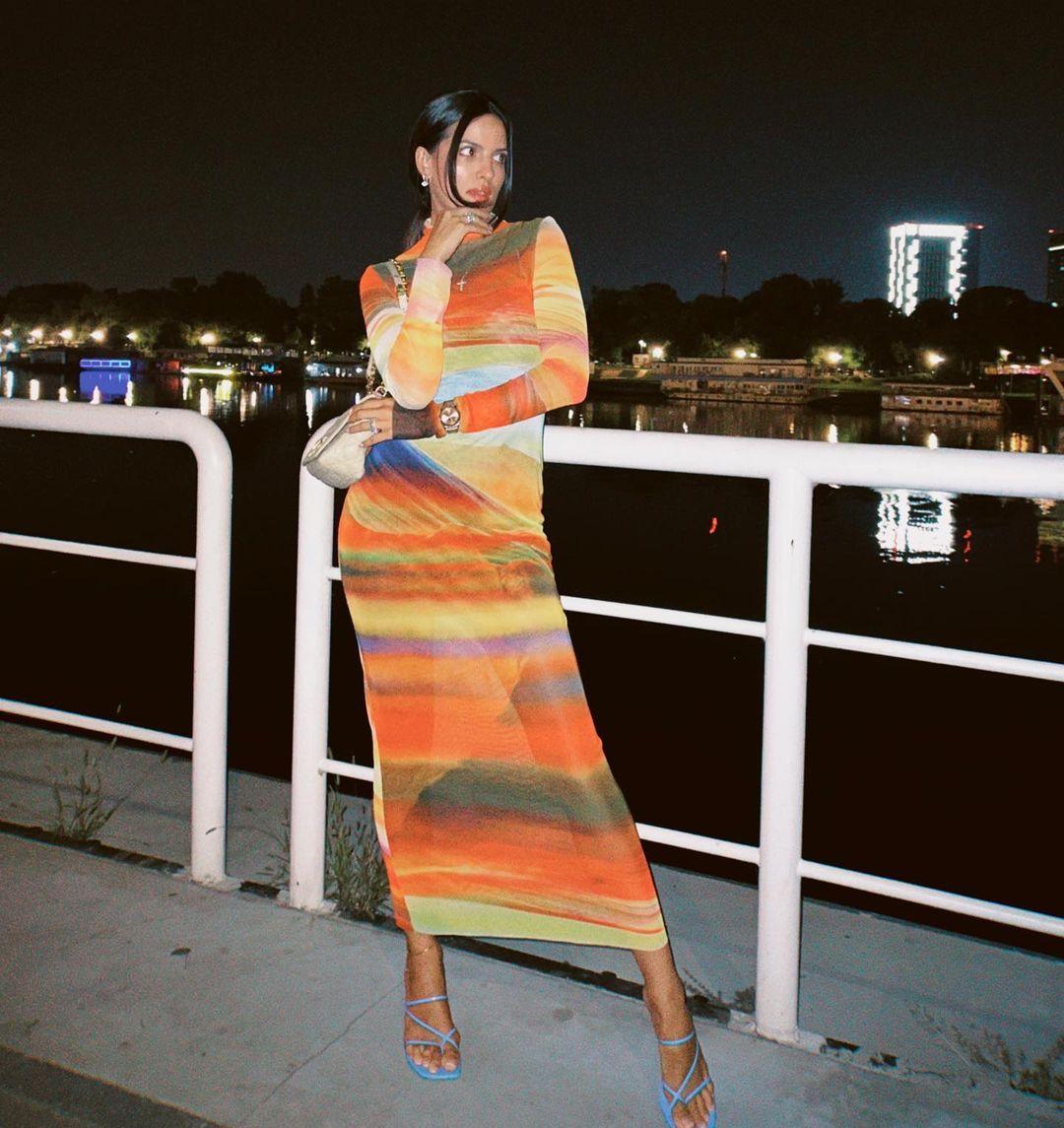 She paired it with strappy heels and accessorized with multiple rings and a stylish watch