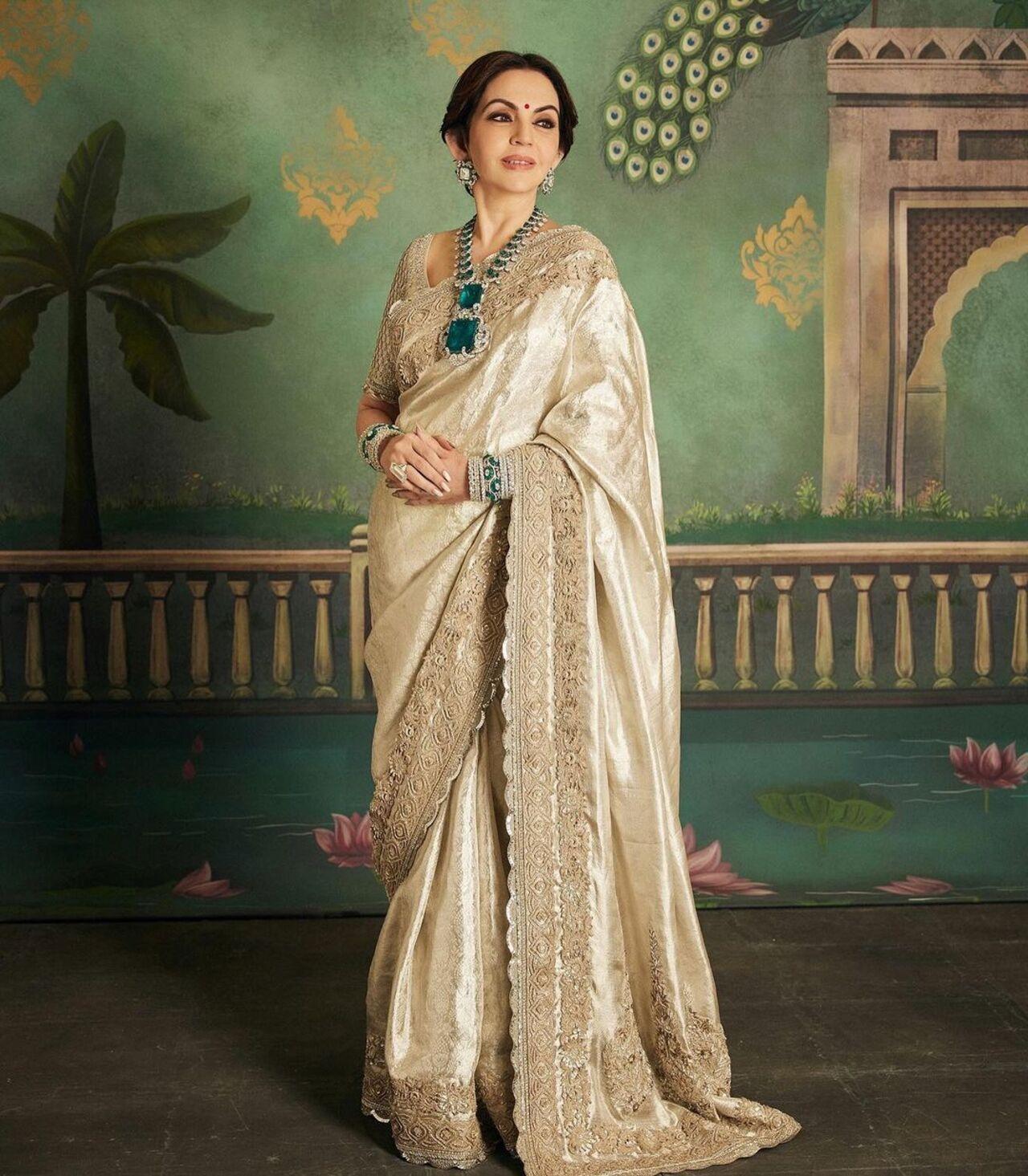 Nita Ambani wore a handloom Kanchipuram saree for Anant and Radhika's pre-wedding celebrations in Jamnagar. She accessorized this look with a giant emerald and diamond necklace, which reportedly cost Rs 500 crore. 