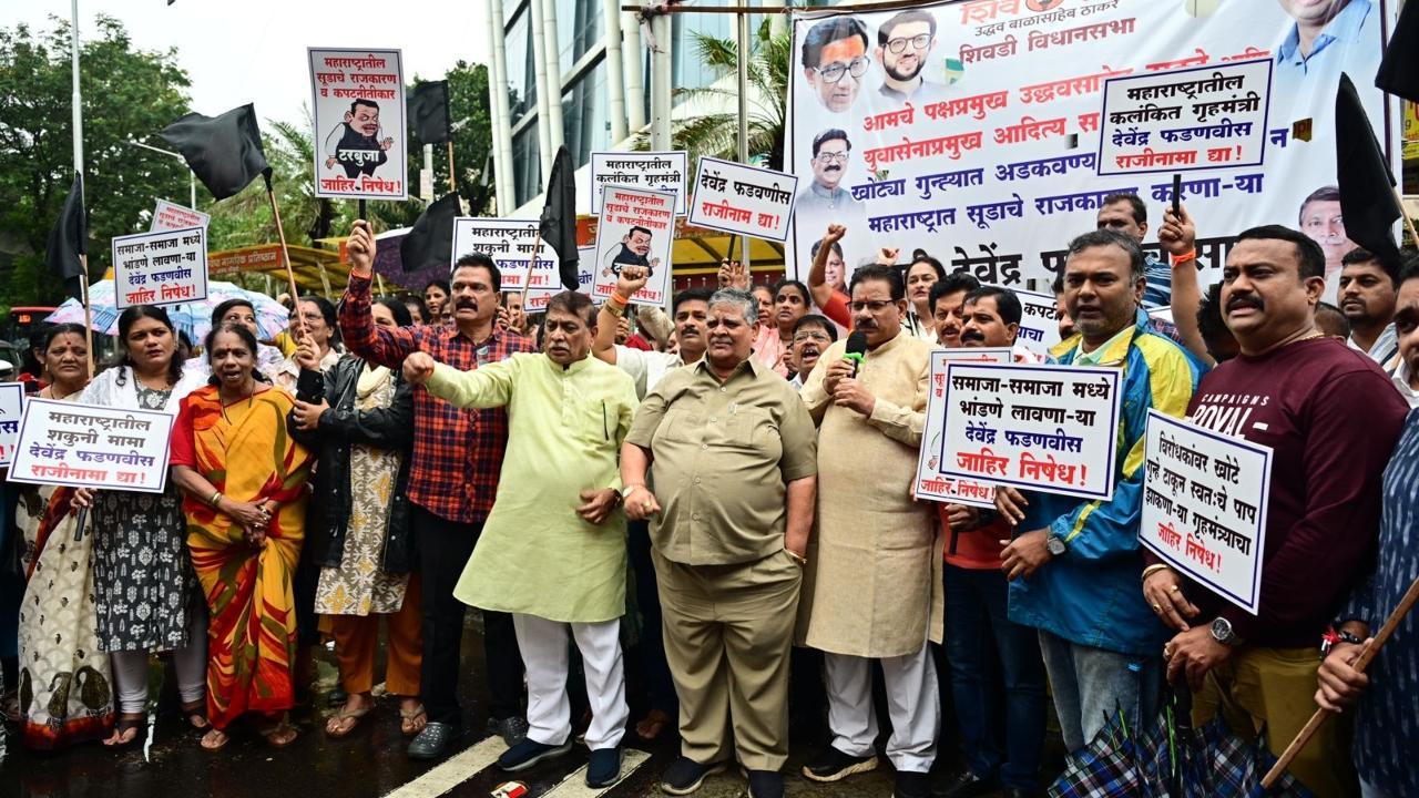 IN PHOTOS: Shiv Sena (UBT) workers protest against Dy CM Fadnavis