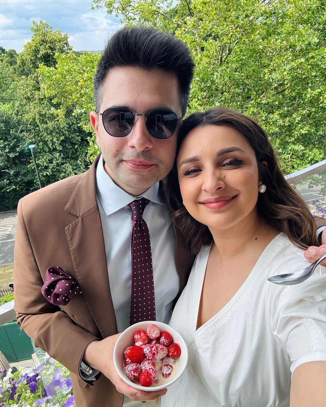 Raghav and Parineeti also posed with a bowl of strawberries and cream, in keeping with Wimbledon tradition.