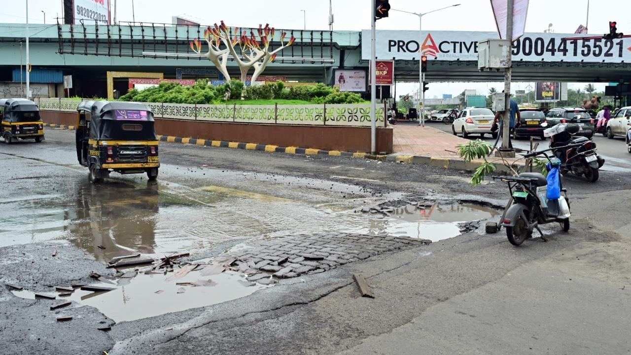 IN PHOTOS: Month into monsoon, potholes make appearance on Mumbai roads