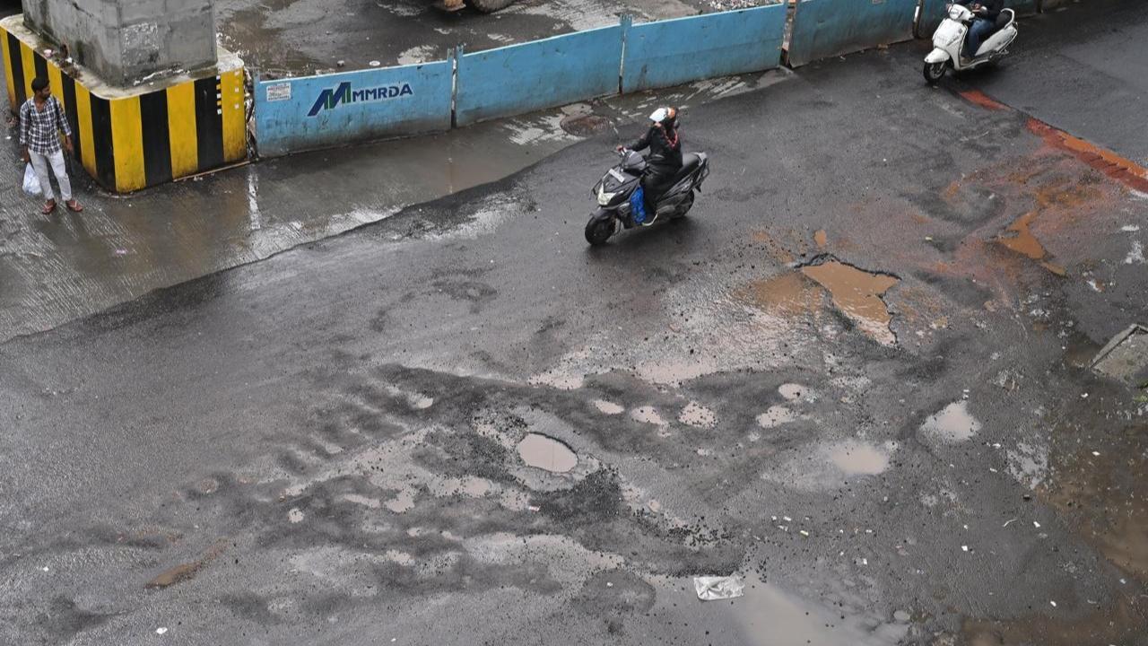 IN PHOTOS: Motorists complain of potholes in Mumbai as rains continue in city