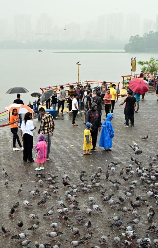 People visit Powai Lake amid rains