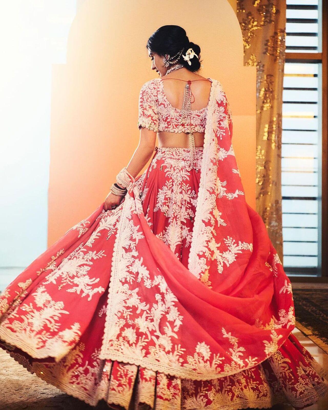 Radhika also wore a red traditional lehenga for the ceremony