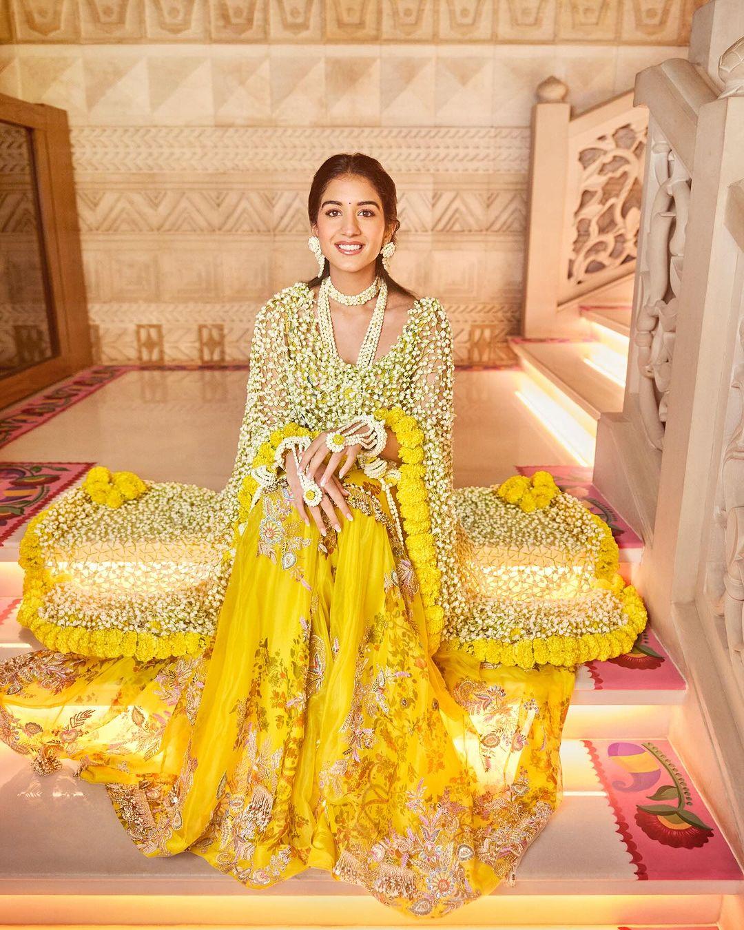 Stylist Rhea Kapoor shared pictures of her look. Radhika wore a 'phool dupatta' over what appears to be a sharara by Anamika Khanna and accessorized with jewellery made from flowers.