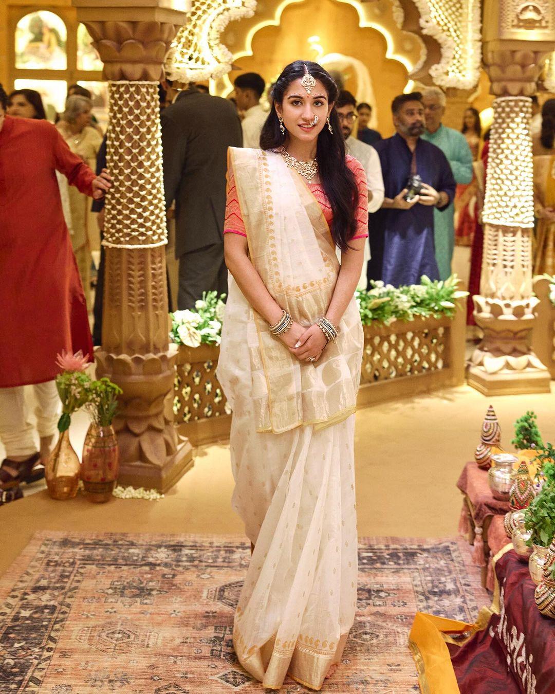 Radhika Merchant looked elegant for her Graha Shanti Puja in a white saree paired with a blush pink blouse. 