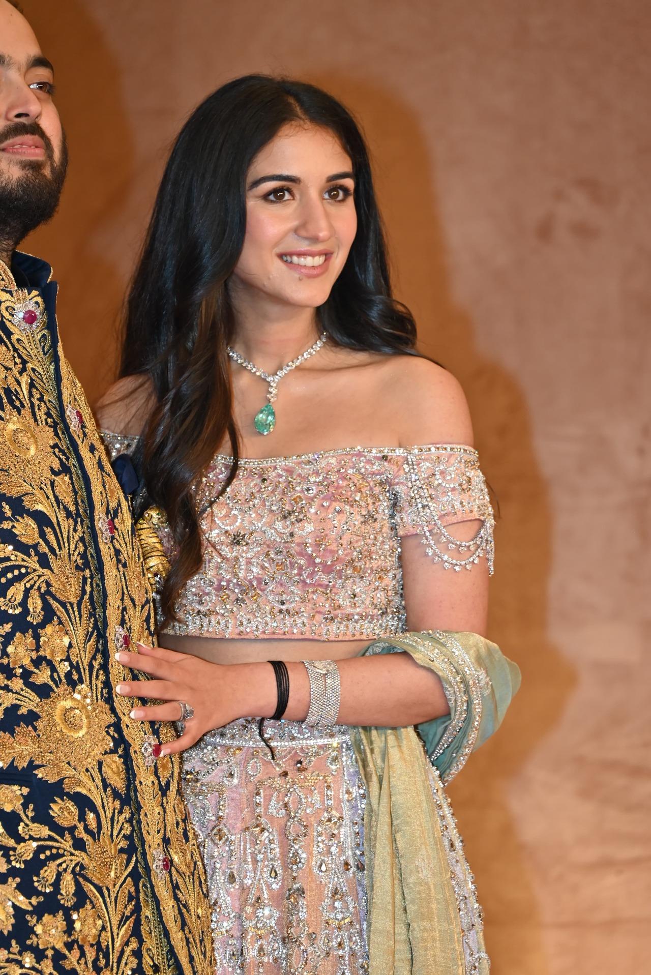 Radhika Merchant took center stage in custom Abu Jani Sandeep Khosla. She wore a tissue skirt in a feast of pastel hues hand-embroidered in dazzling Swarovski crystals. 