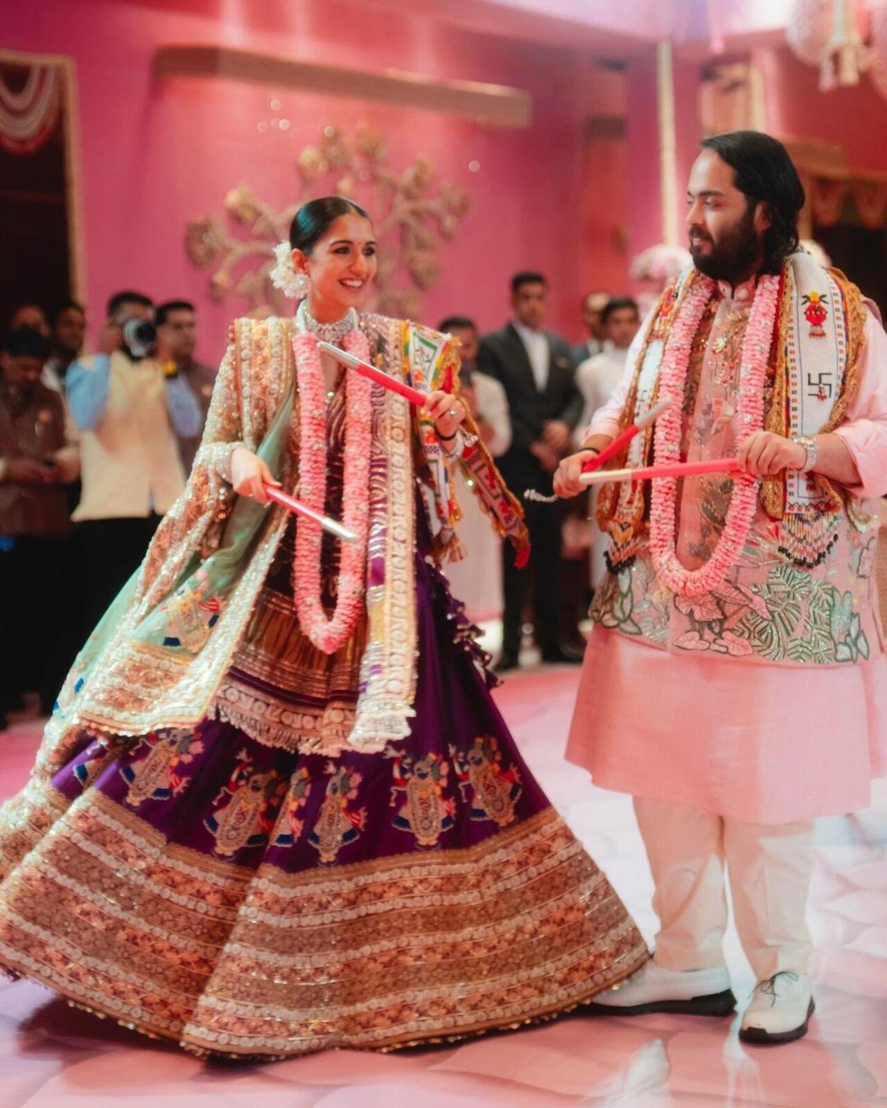Radhika twirls in her stunning lehenga with Anant on garba night at the Antilla residence