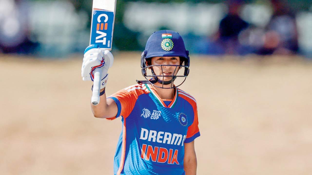 India skipper Harmanpreet Kaur celebrates her 50 v UAE yesterday