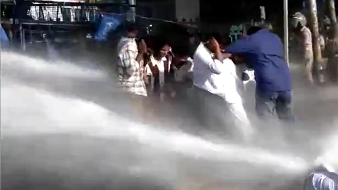 The police used water cannons to disperse the Students Federation of India (SFI) activists, who became violent by pulling down the barricades set up by the police and were also seen smashing a riot-shield used by the force