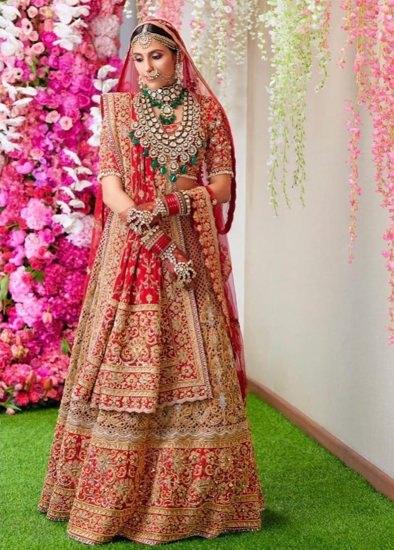 For the wedding, Shloka looked divine in her red and gold lehenga with a net dupatta with thin gold detailing and a choli with intricate embroidery and fine gold stitch. 