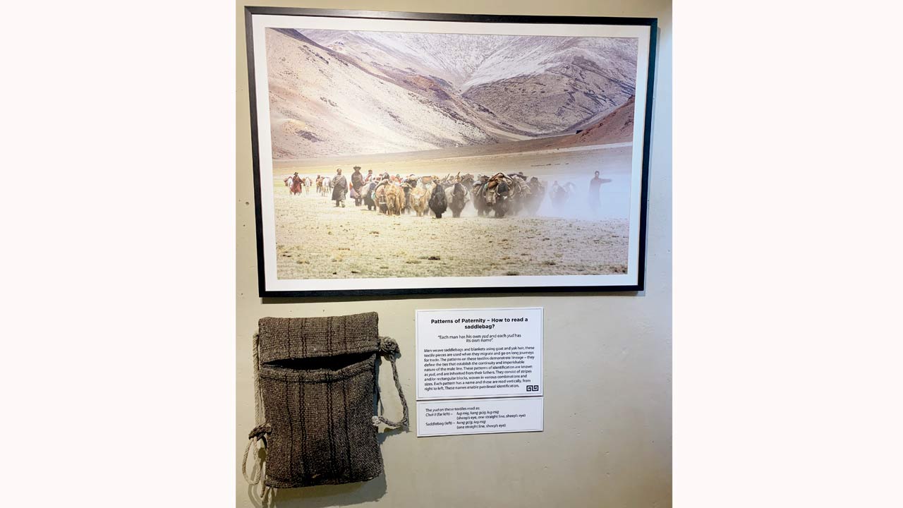 Patterns of Paternity – How to read a saddlebag? featured in Threads That Talk: Woven Narratives from Changthang at Ladakh Arts and Media Organisation, Leh. Each man weaves a unique “yud” made from goat and yak hair for saddlebags and blankets, symbolising lineage continuity, identified patrilineally by its distinct patterns read vertically right to left for identification