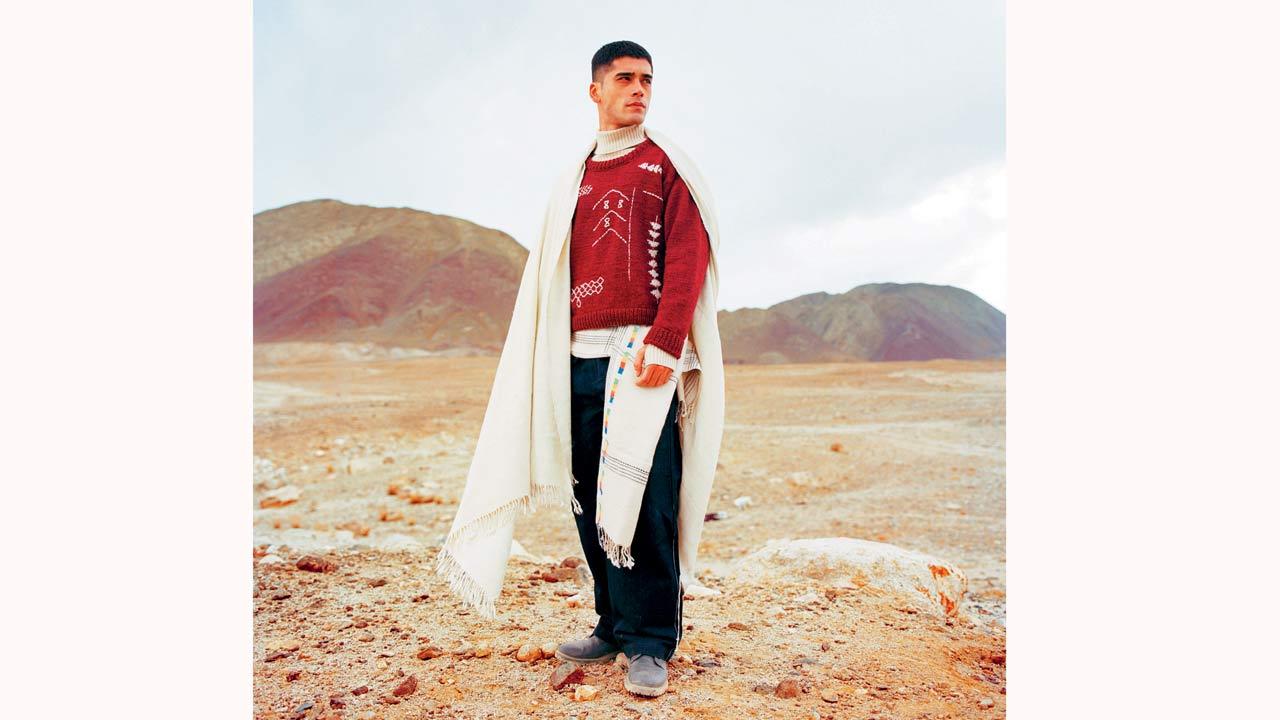 The Hanle sweater in burgundy and Korzok shawl are part of the sheep wool collection by Royal Enfield x Eka for Looms of Ladakh 