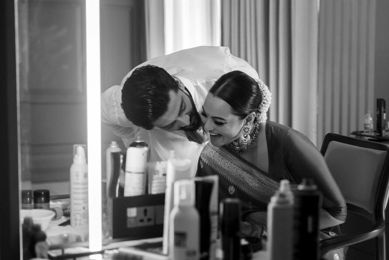 Here Zaheer is watching his bride get ready ahead of the reception and disrupts the course by doing something silly to make her laugh. 