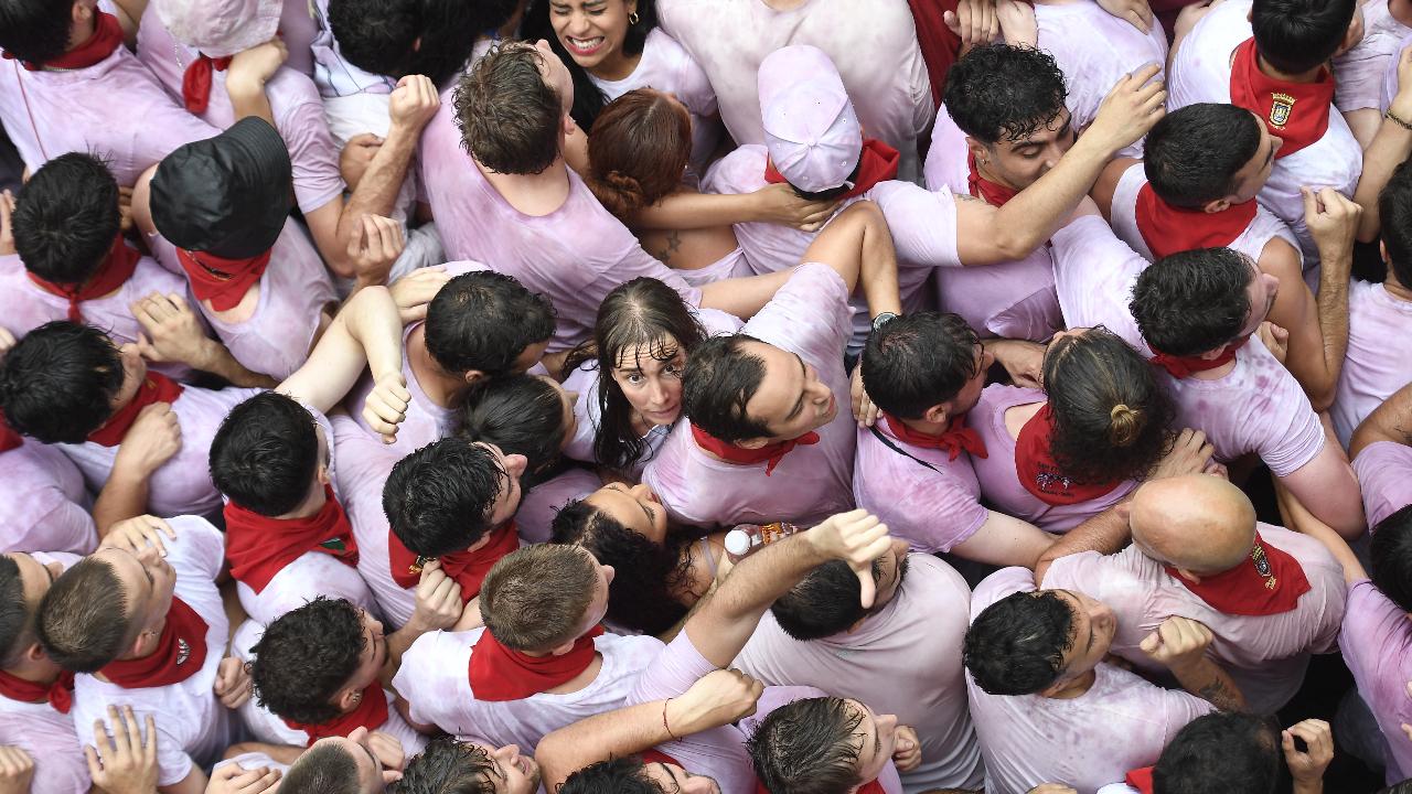 In Pamplona's San Fermín festival, it's a tradition for some participants to drench themselves in wine before the running of the bulls. This ritual, known as the 