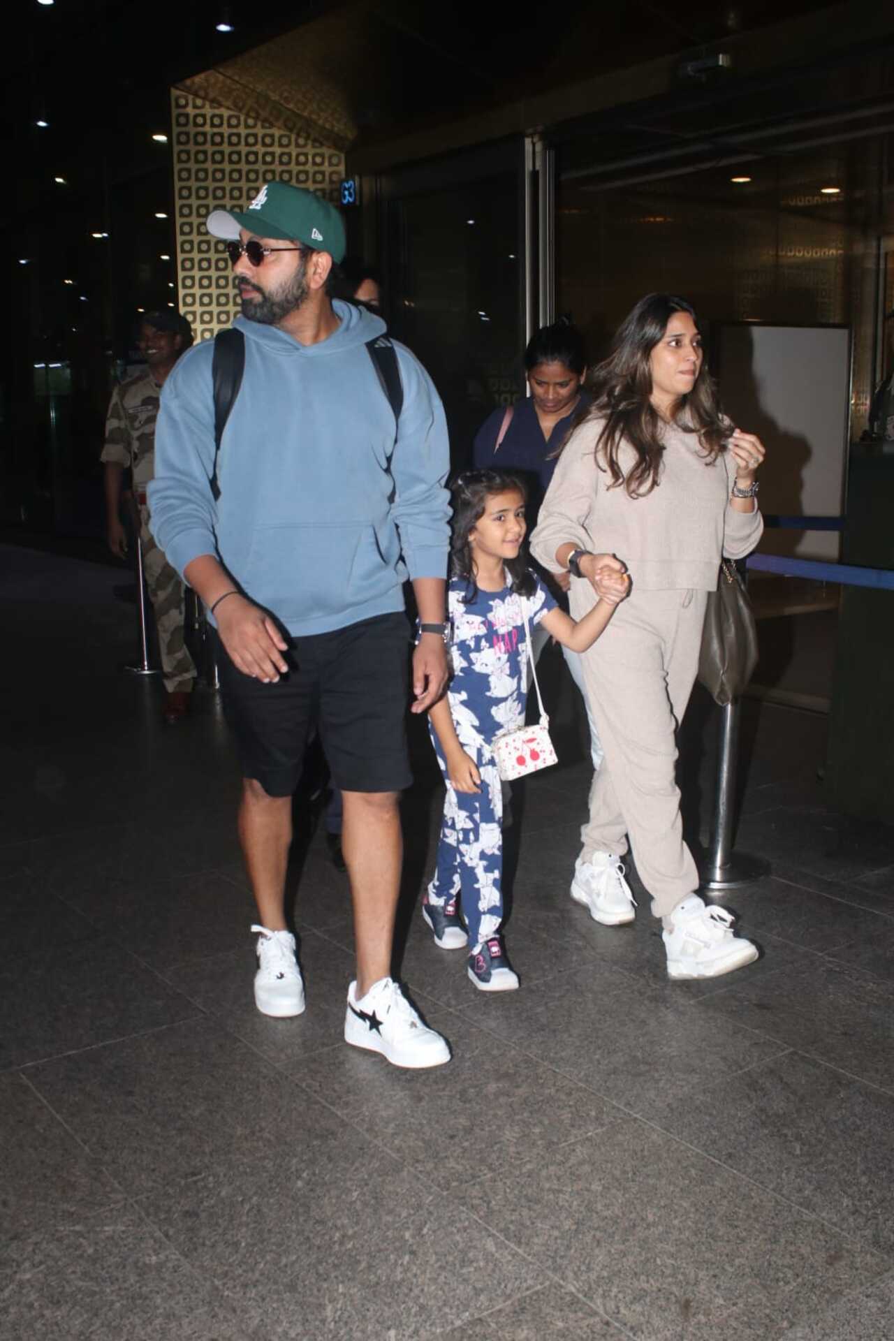 Indian cricket team captain Rohit Sharma with his wife Ritika and their daughter spotted at the Mumbai airport