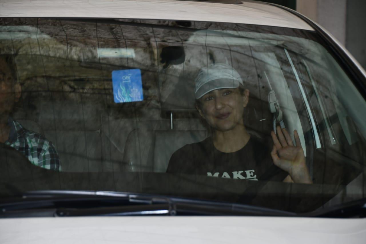 Sara Ali Khan waved to the cameras from inside her car today