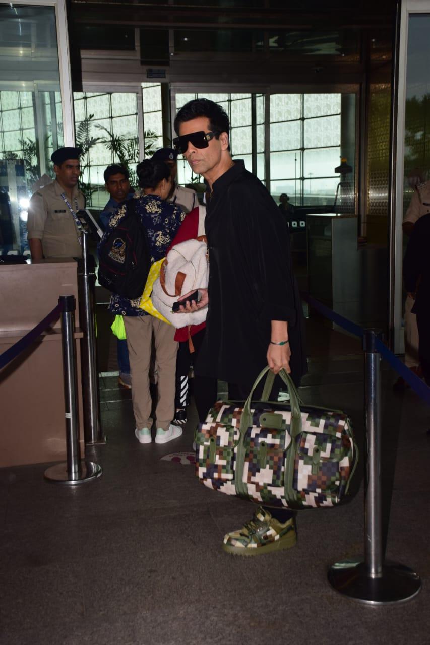 Karan Johar smiled at the papz as he got clicked