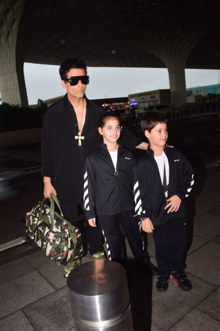 Karan Johar was clicked with his twins at the airport