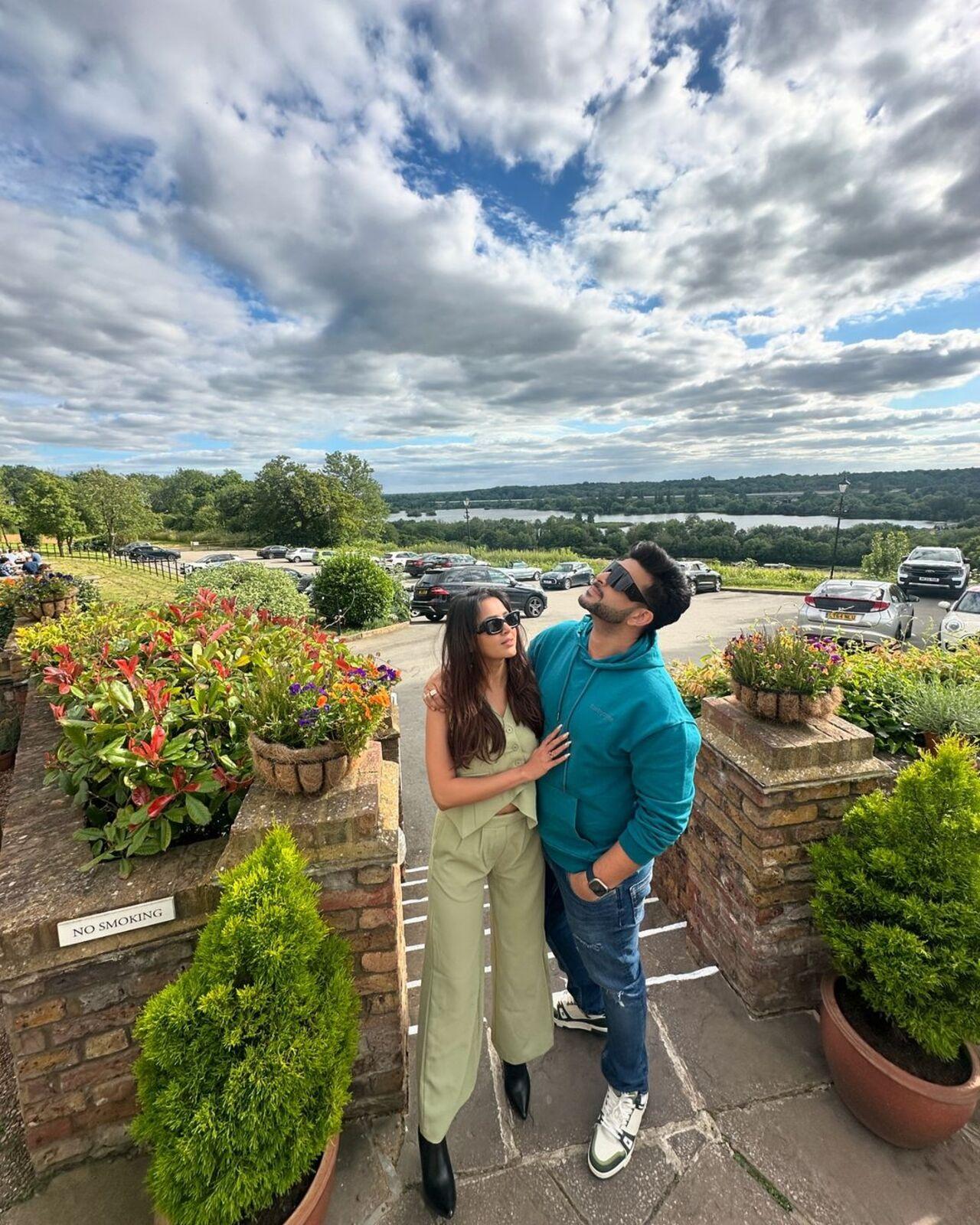 Look at how Tejasswi is trying to make Karan pose while he's making sure to tease her with his cute actions
