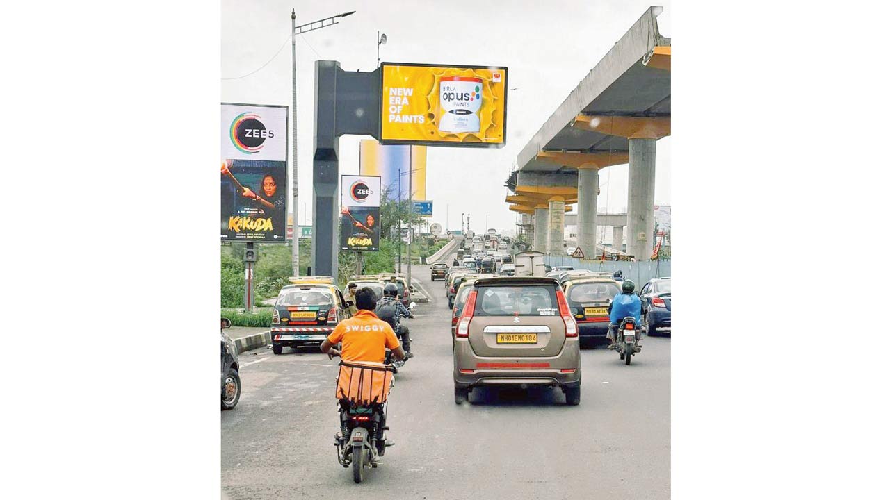 Hoardings on the footpath along the Western Express Highway. File pic