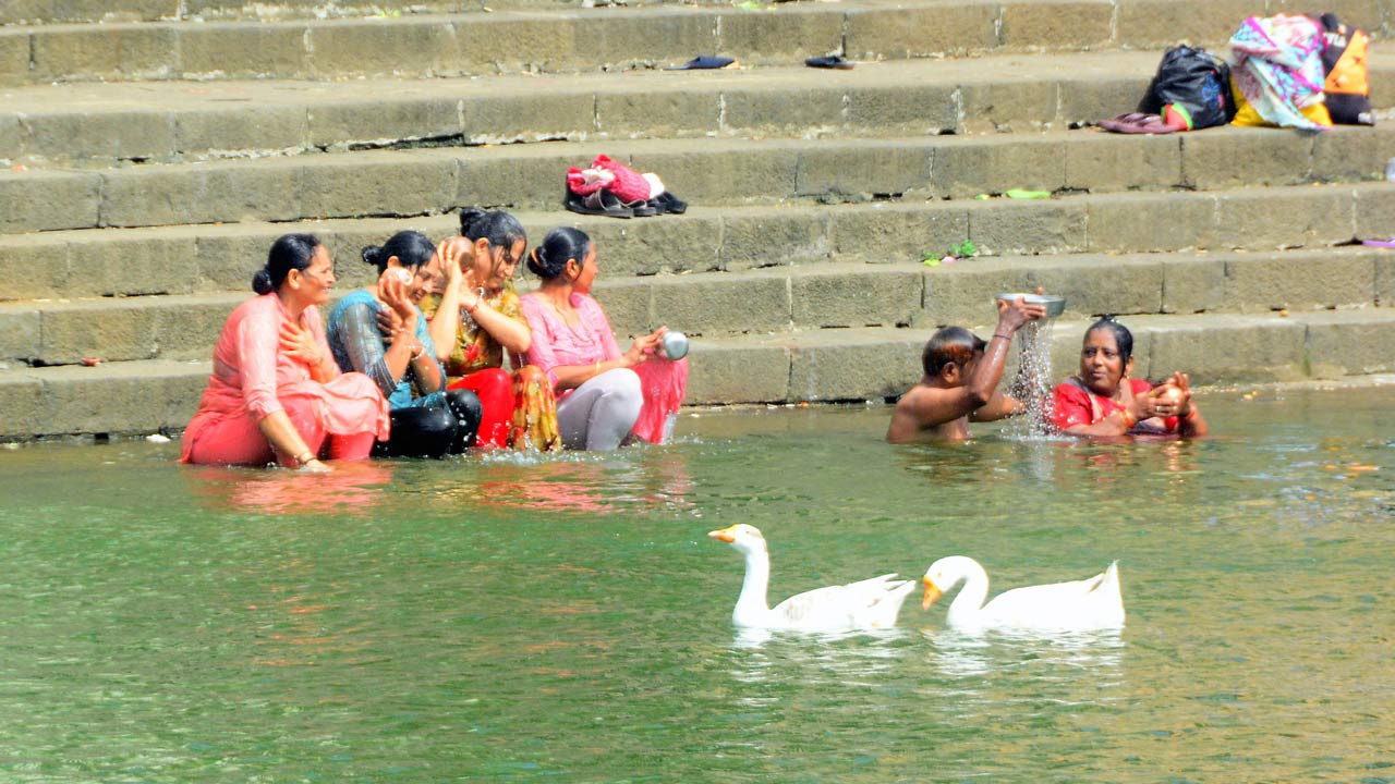 Visitors at the Banganga tank. File pic