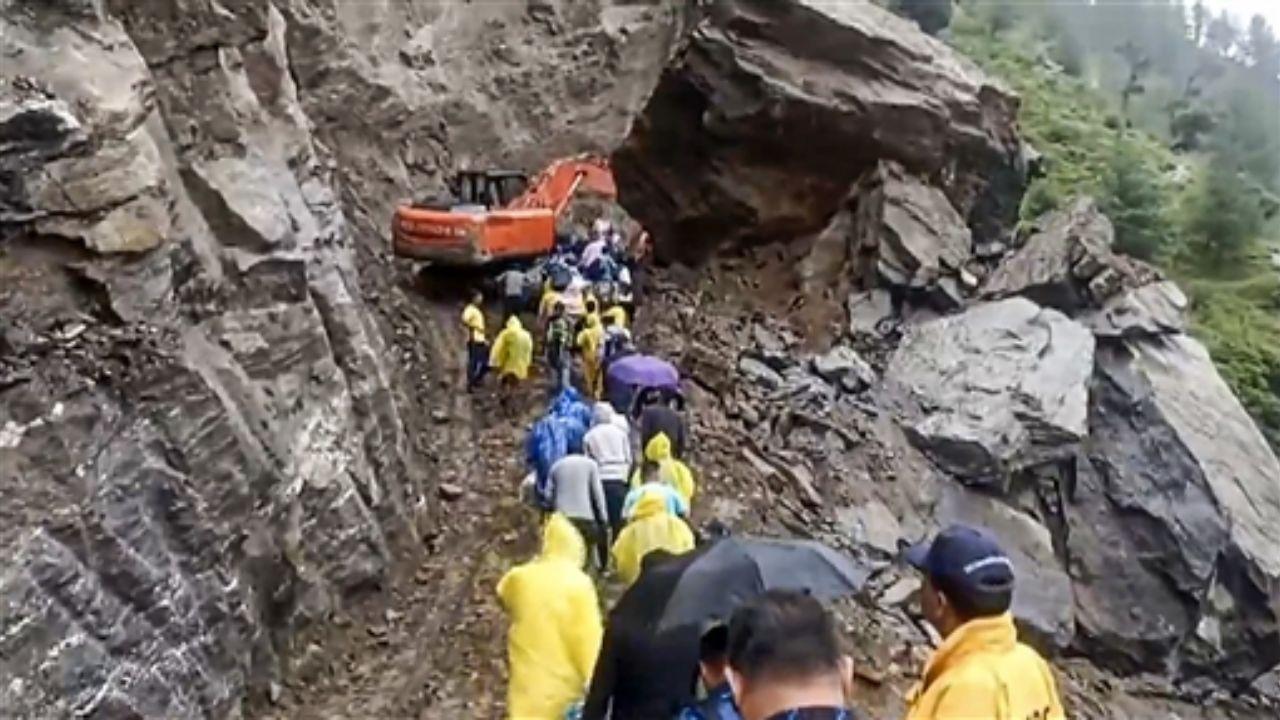 Uttarakhand: SDRF helps pedestrians cross road as Badrinath Highway opens