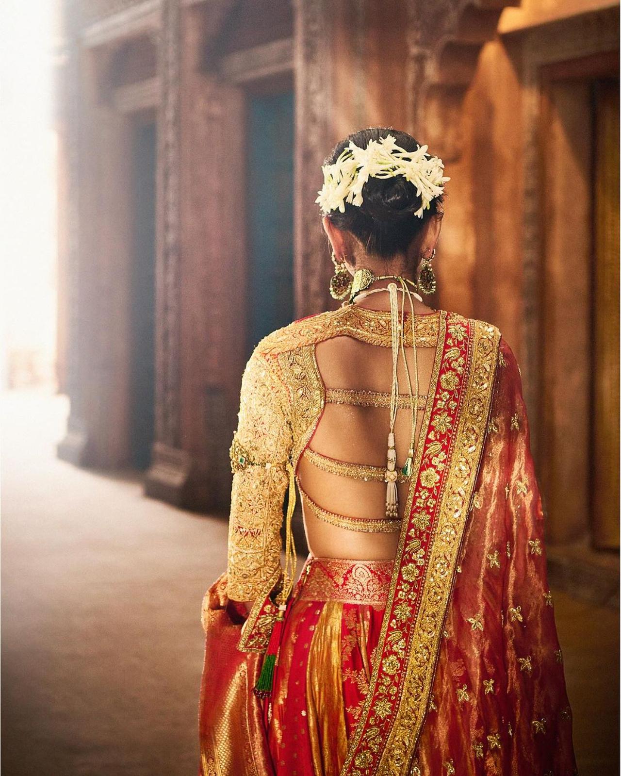 This exquisite blouse features real gold karchobi work, inspired by the traditional abho and the rich textile heritage of Kutch, Gujarat, echoing the artistry of the late 19th century.