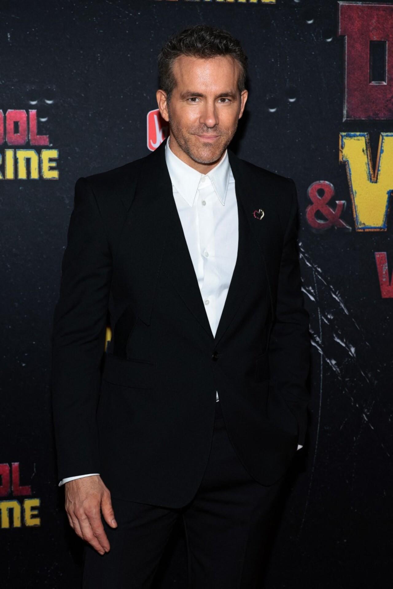 Canadian-US actor Ryan Reynolds who plays Deadpool, attended the premiere in a black suit and white shirt. 