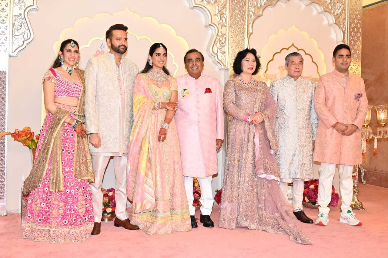 Ambani family poses with a guest
