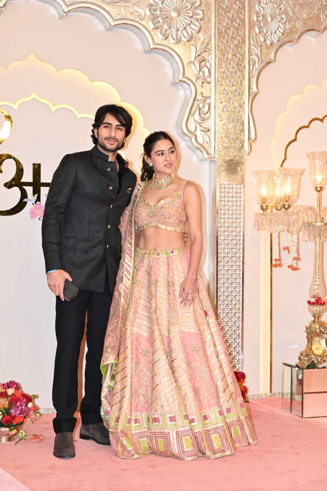 Siblings Sara Ali Khan and Ibrahim Ali Khan pose together as they arrive for the wedding