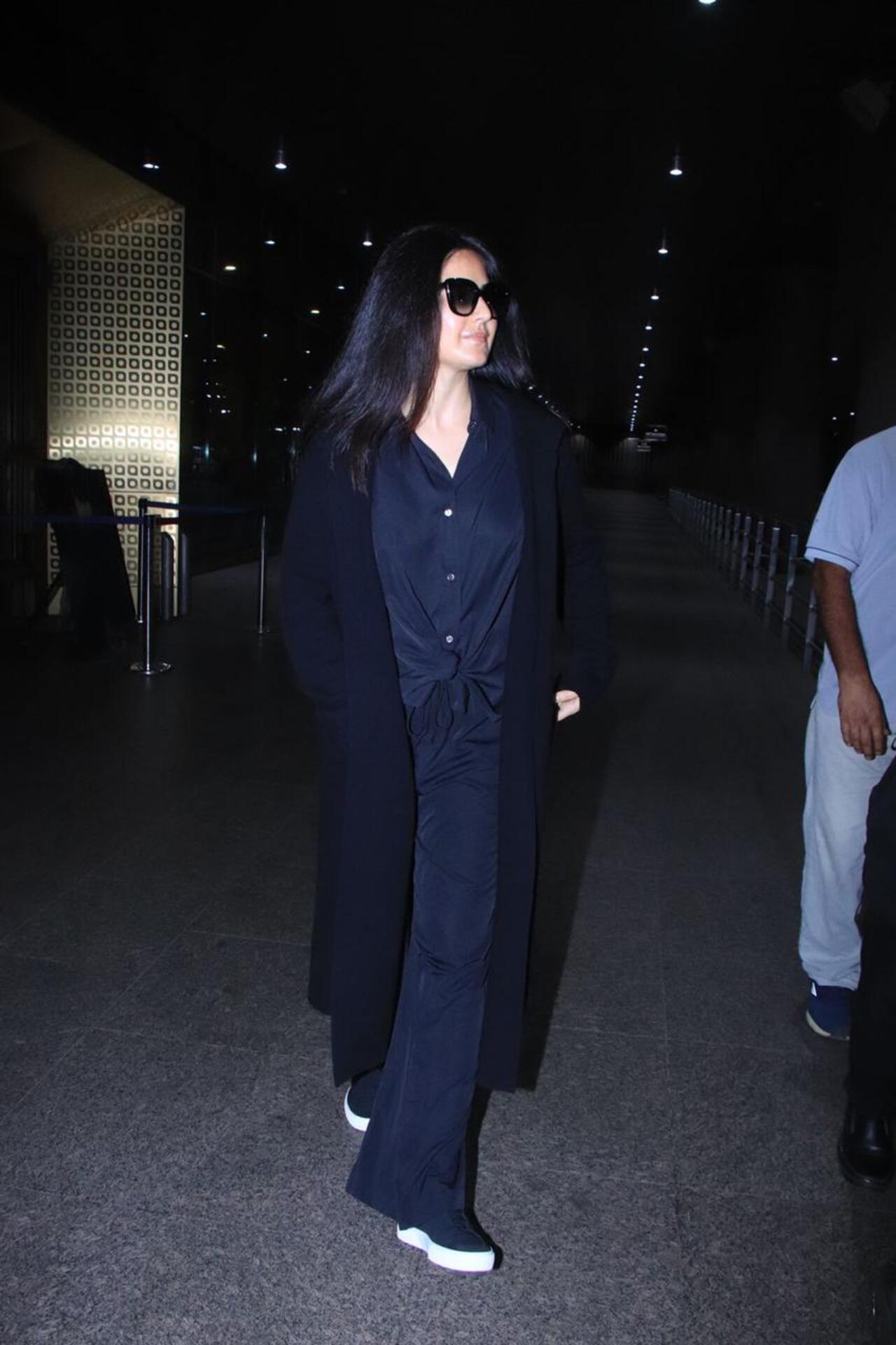 Katrina Kaif returned to Mumbai after a long vacation in London. She was spotted in an all-black ensemble with netizens trying to spot her alleged baby bump. 
