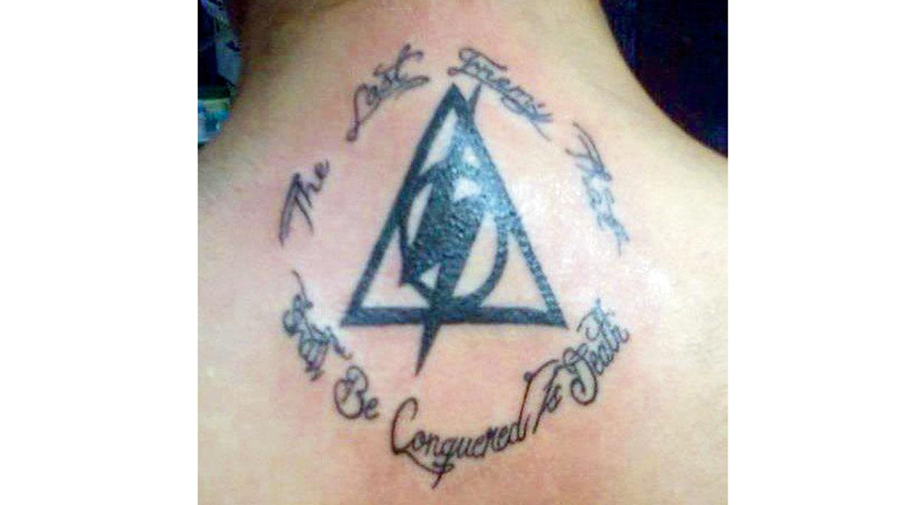 Irani’s tattoo of the Sign of the Deathly Hallows